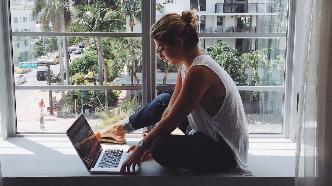 Woman working in a window planning her retirement savings