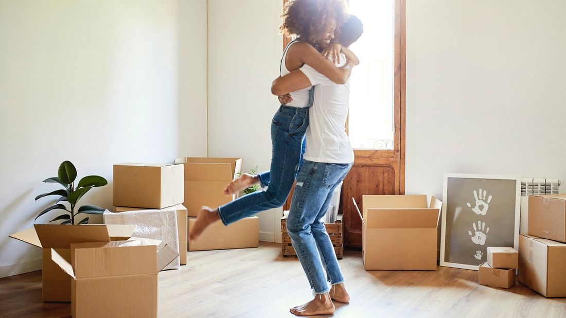 Young couple moving into new house 