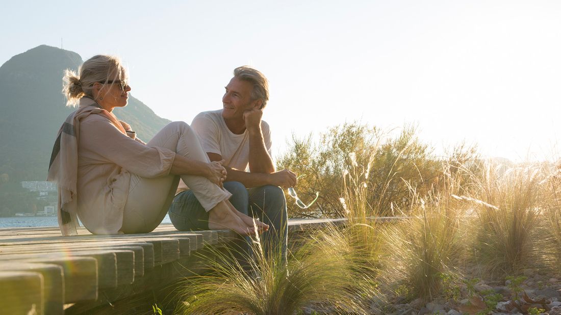 couple relaxing on boardwalk