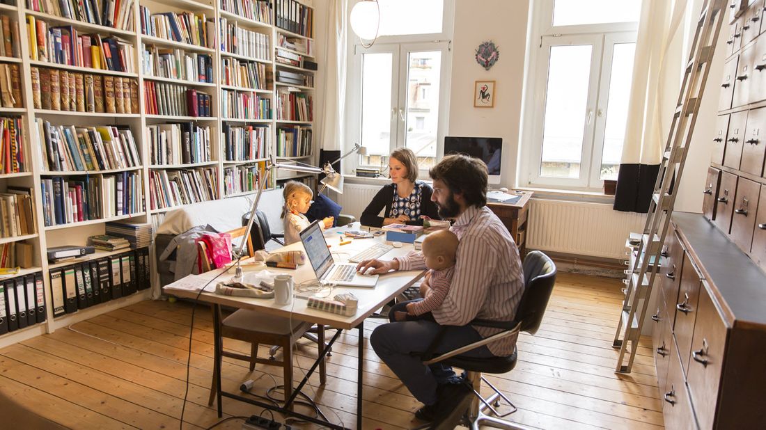 Couple with children researching life insurance and the coronavirus.