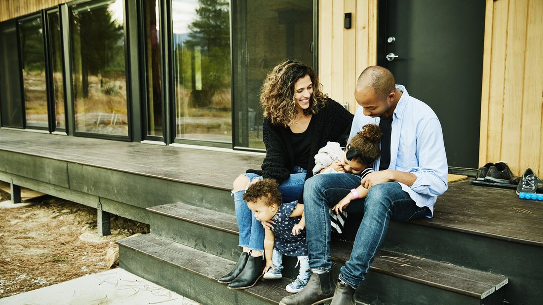 Family sitting on a porch.