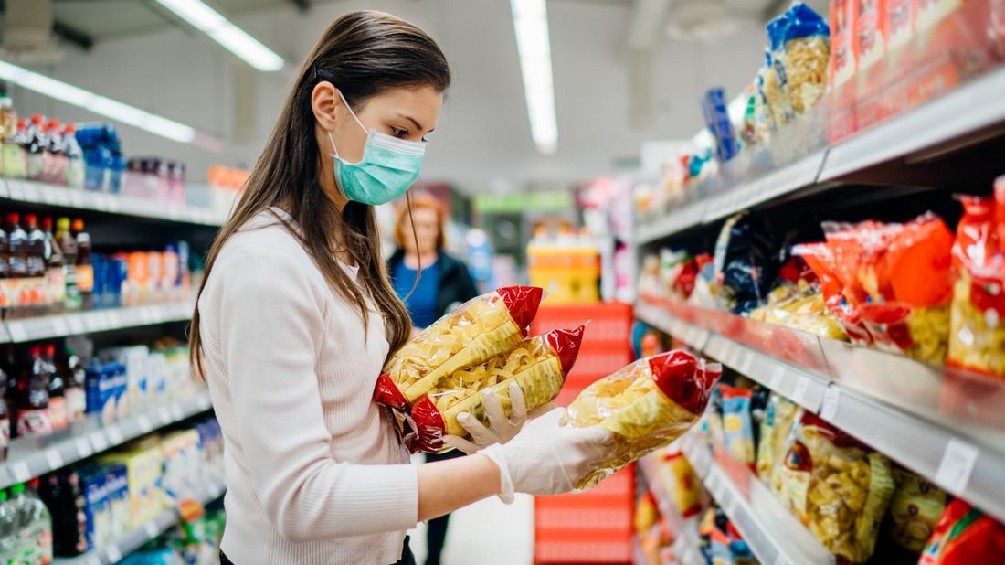 woman grocery shopping during pandemic