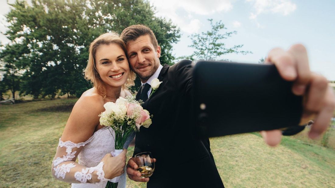 bride and groom streaming their virtual wedding