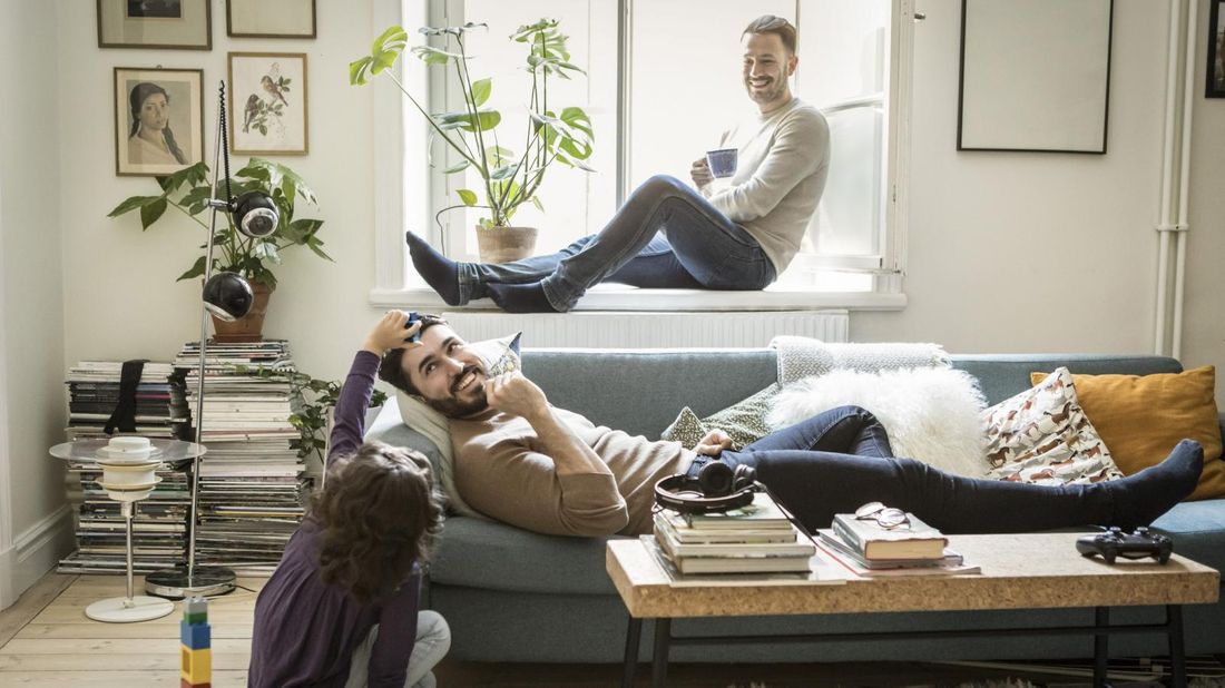 two fathers playing with their daughter during quarantine