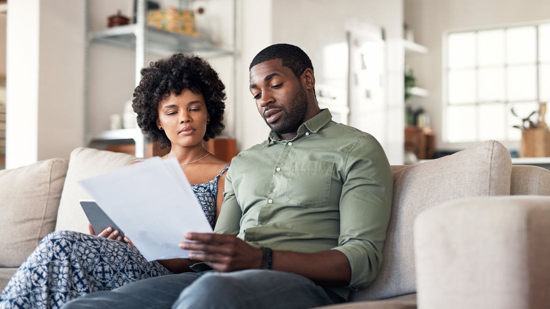 Couple looking at their budget and considering a financial plan as the coronavirus has changed how we think about money.