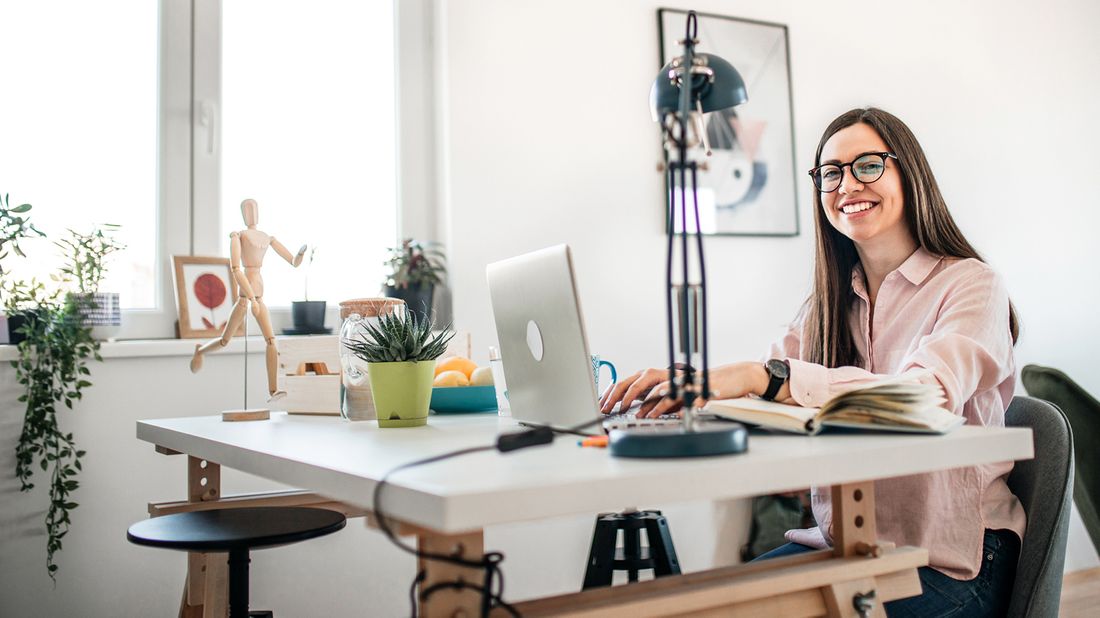 smiling woman working at home