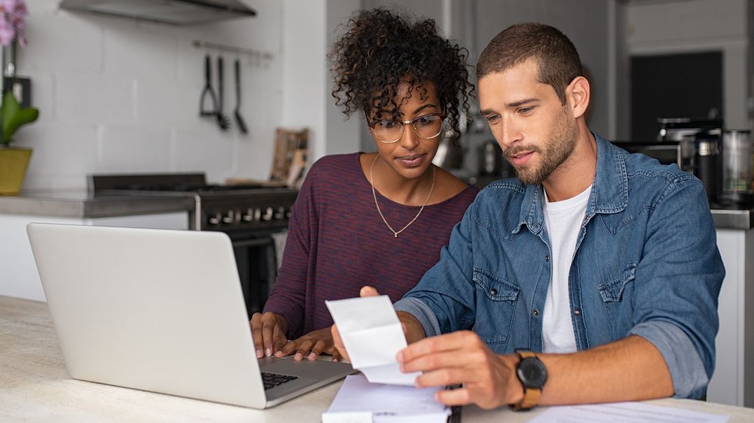 young couple examining their finances