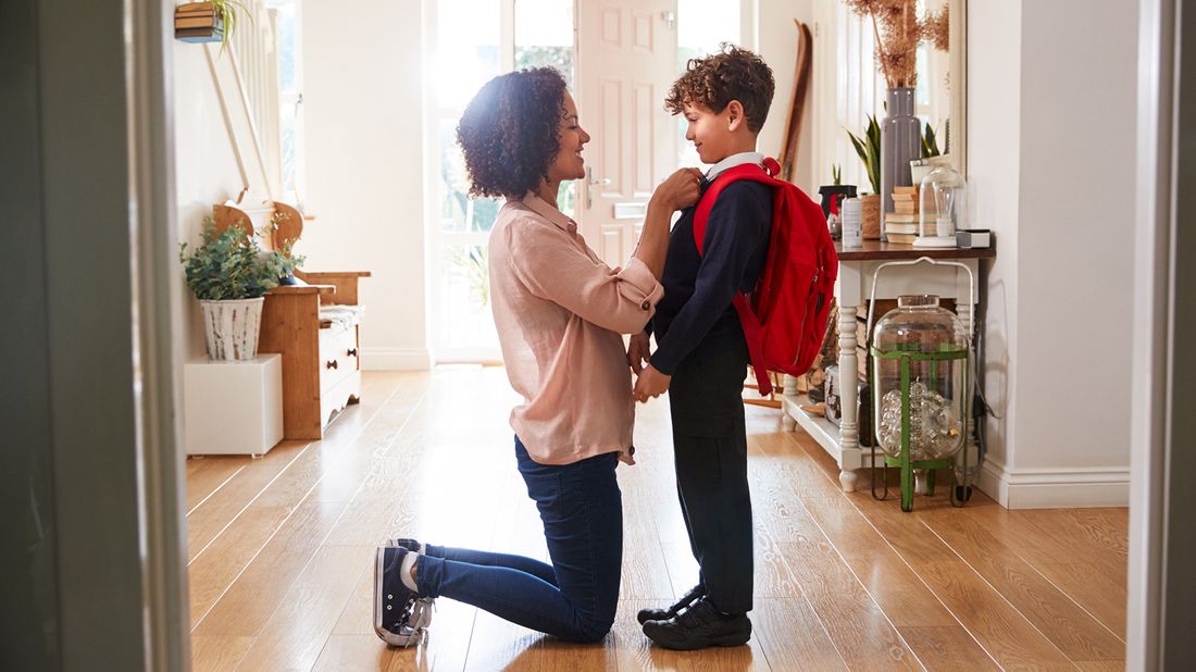 mother and son getting ready for school