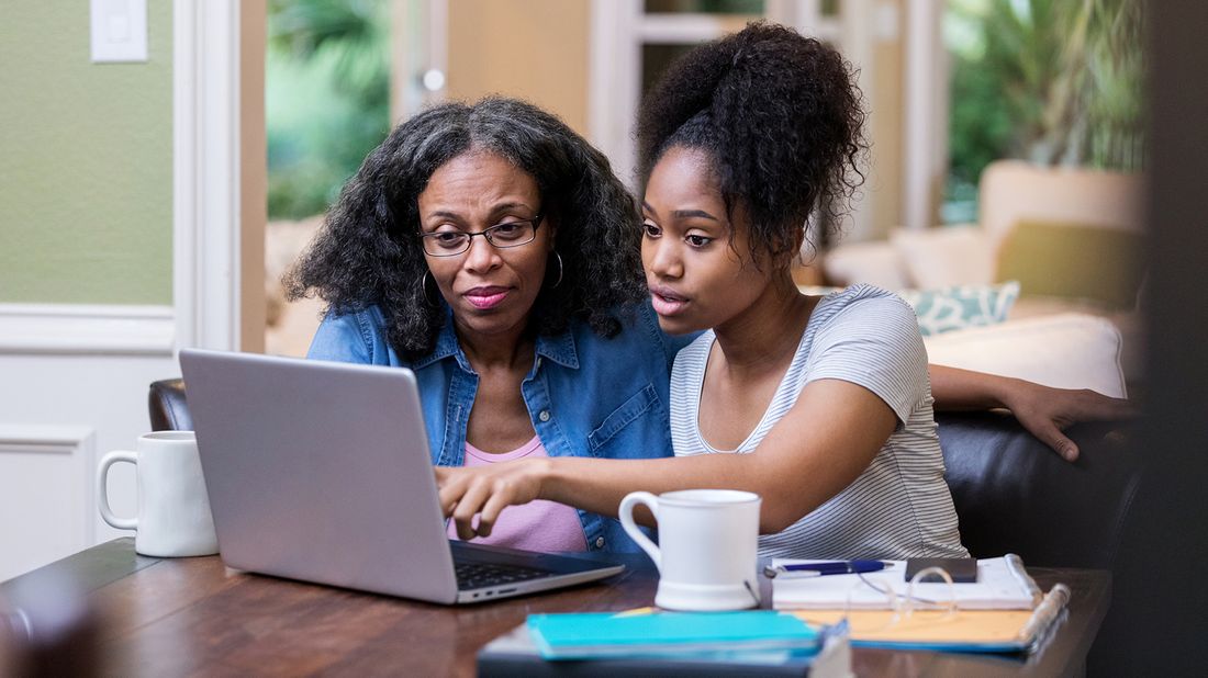 mother and daughter filling out FAFSA on computer