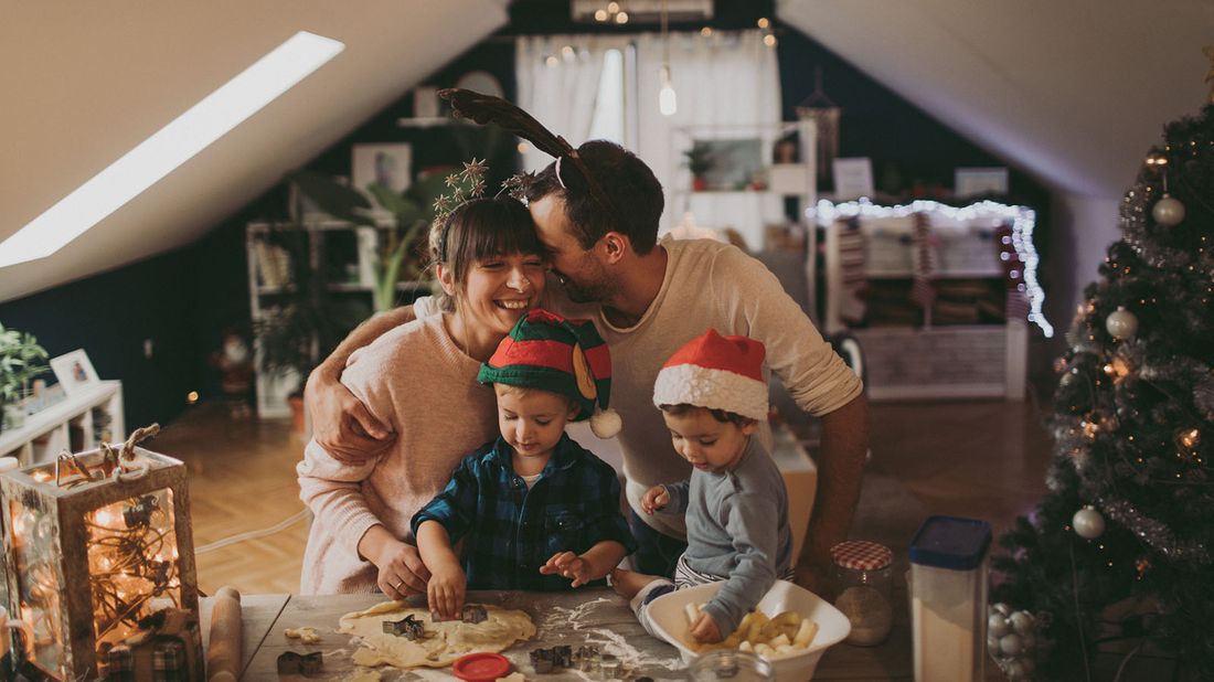 family baking holiday cookies at home