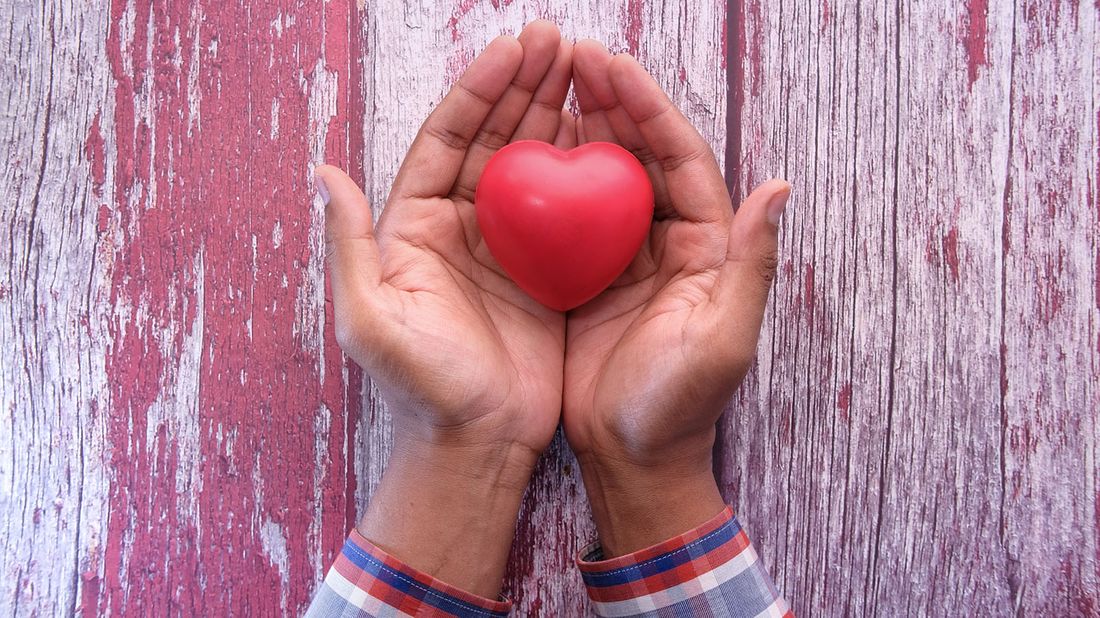 hands holding a heart