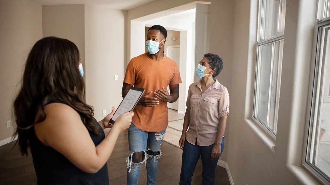 Homebuyers looking at a home during the pandemic trying to avoid homebuying mistakes