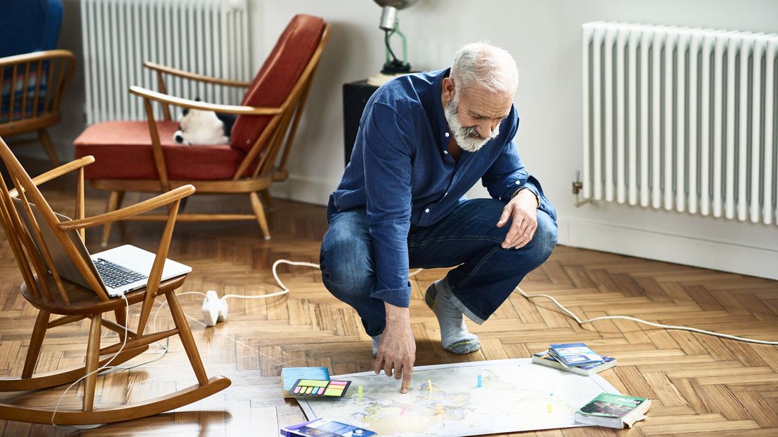 A retired man planning his next trip