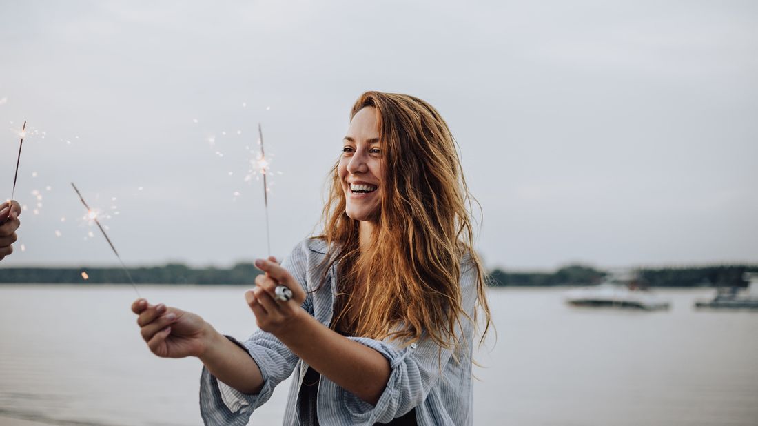 Woman celebrating New Year’s financial resolutions