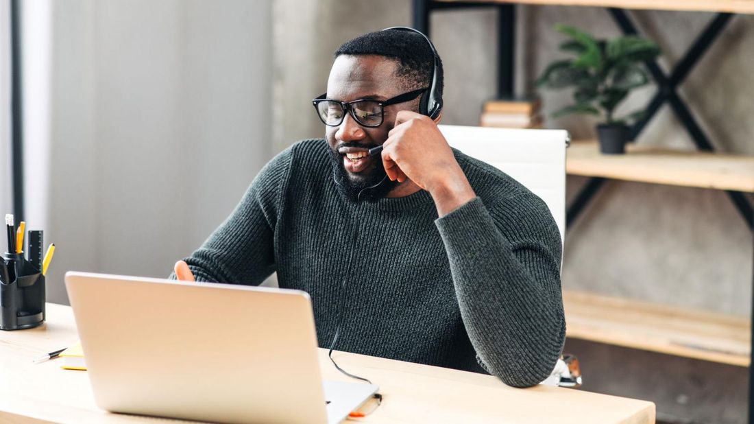 Remote worker doing taxes on home laptop