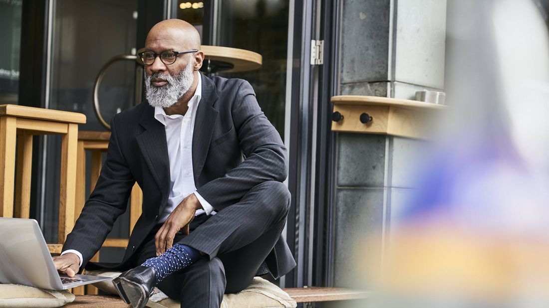 Man working on a computer researching who should not buy an annuity