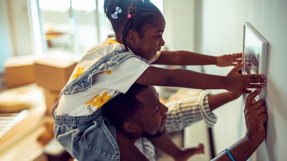 Dad and daughter hanging photo and dad wonders what is a good age to get life insurance. 