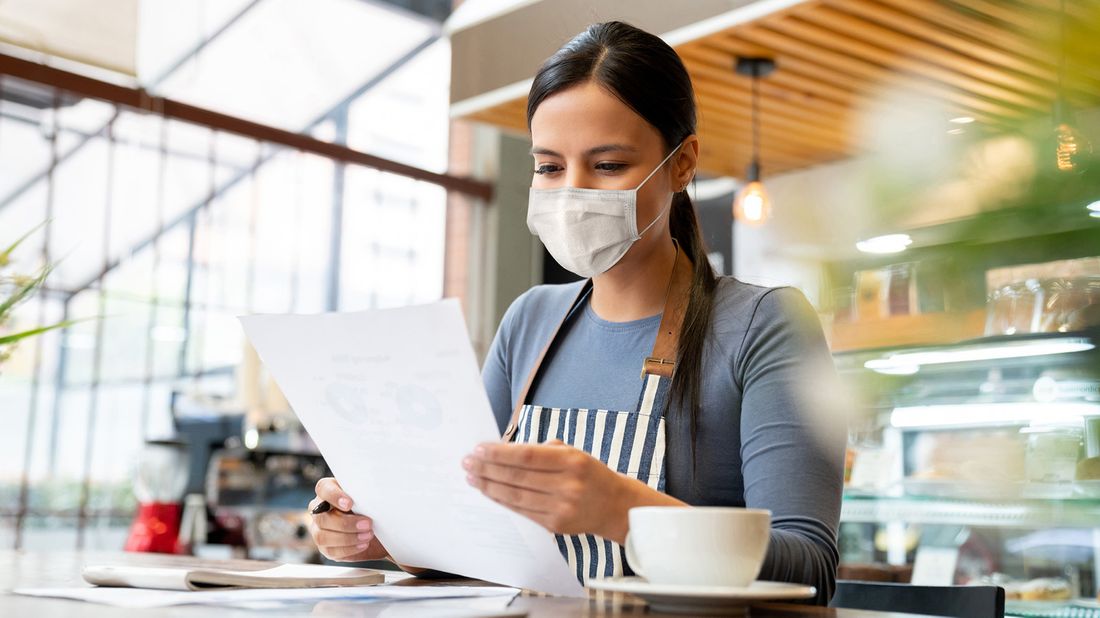 business manager doing the books at a restaurant