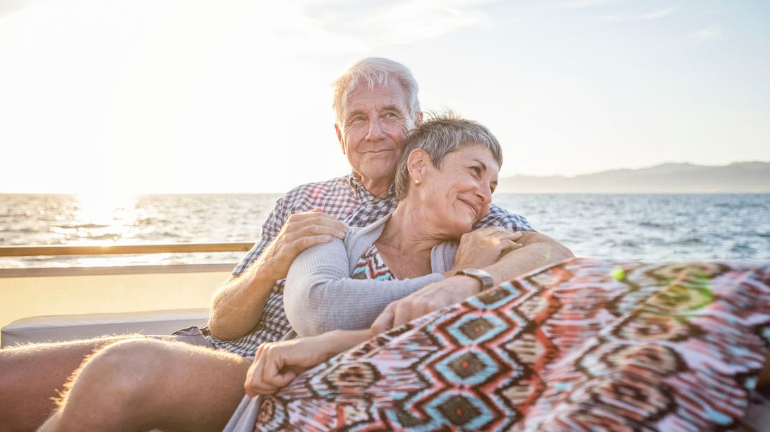 couple on boat trip at sunset