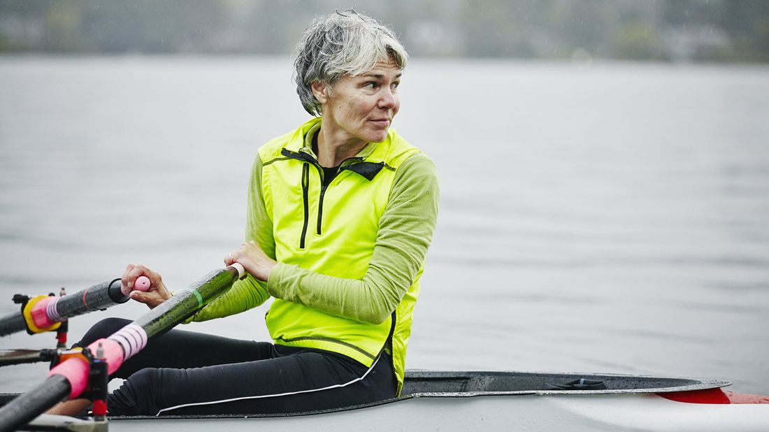 60-year-old woman kayaking and considering her retirement savings