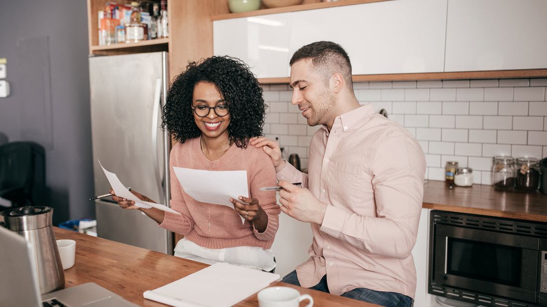 Couple doing their taxes and discussing a strategy to bunch itemized deductions 