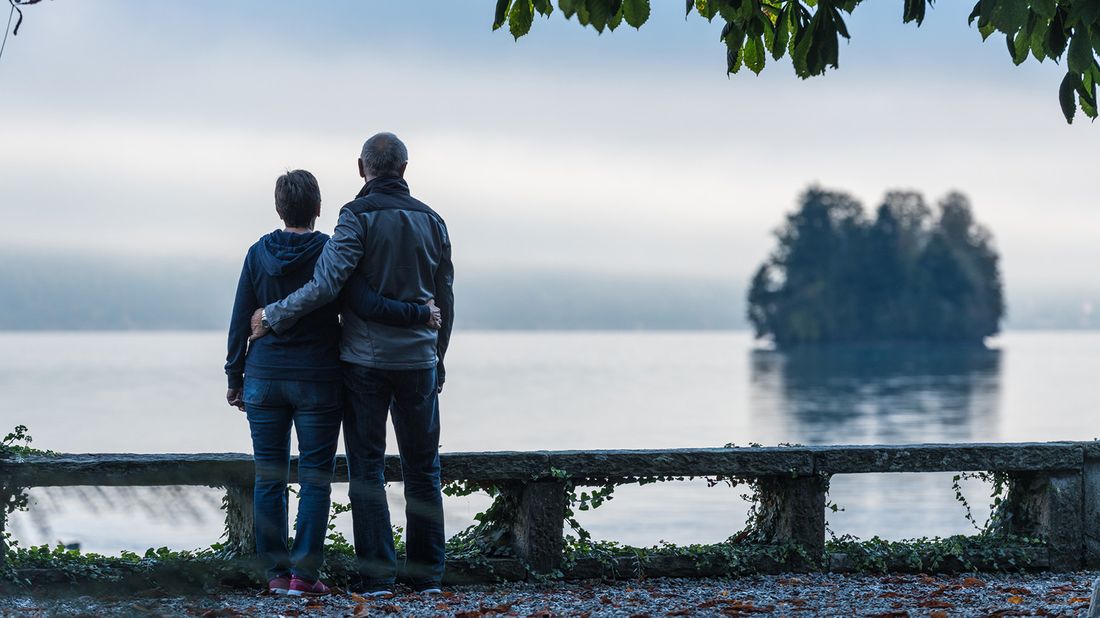 couple looking out over lake