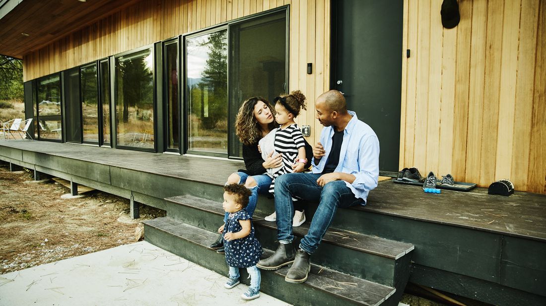 Parents with their children discussing what is included in wealth management