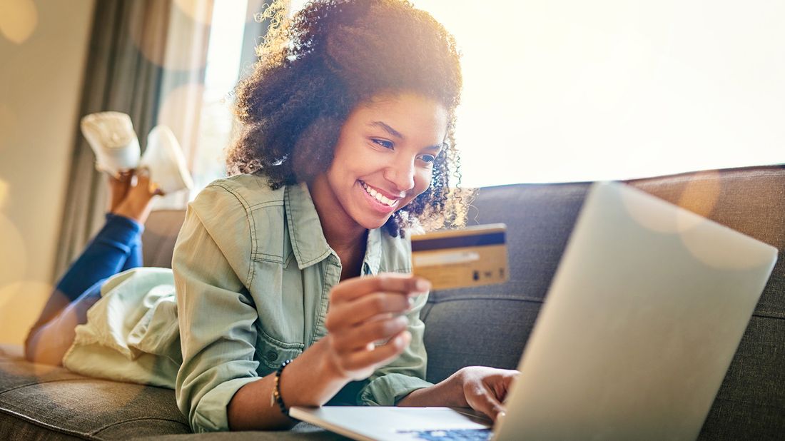 young woman using her credit card