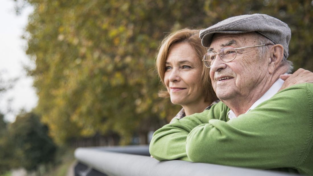 woman and elderly father talking about how much money to give parents 