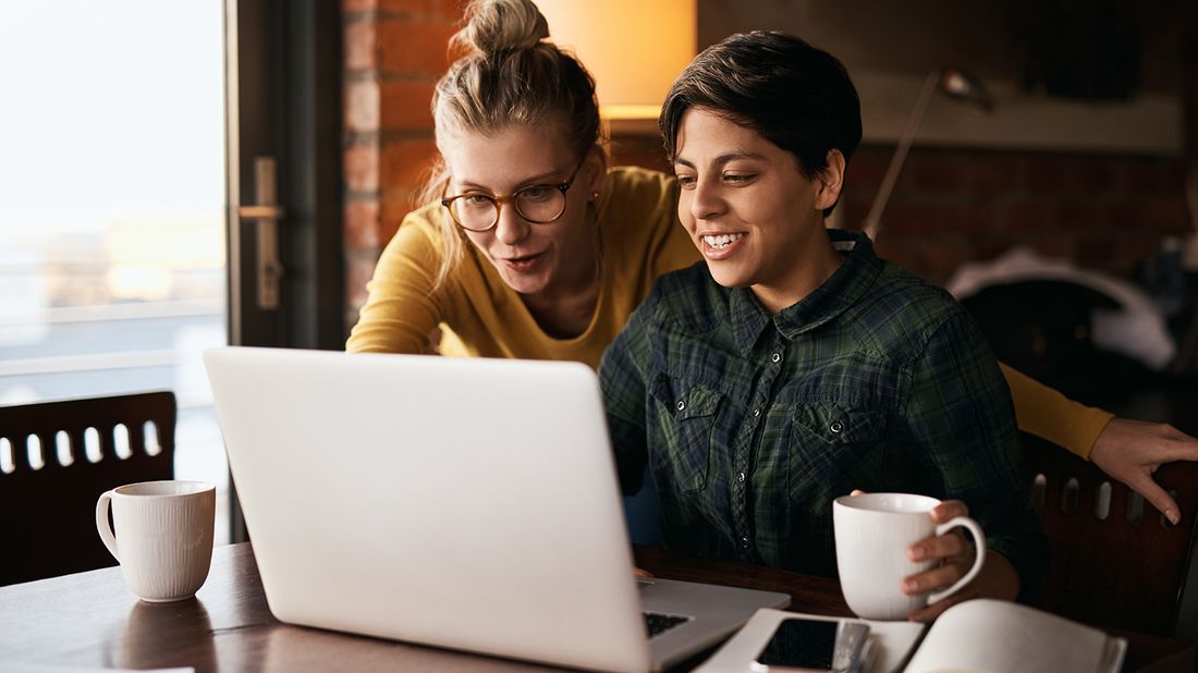 LGBTQ couple looking at their financial plan.