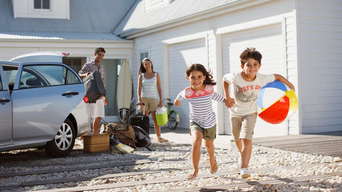 family arriving at beach