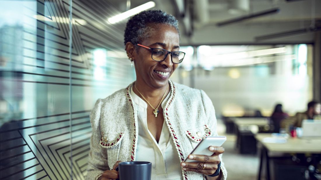 Businesswoman reading Northwestern Mutual Marketing Commentary