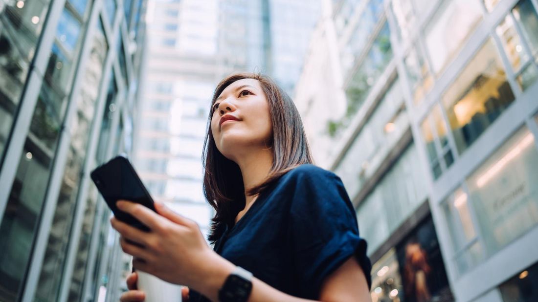 Woman reading Northwestern Mutual Market Commentary for August 2, 2021 