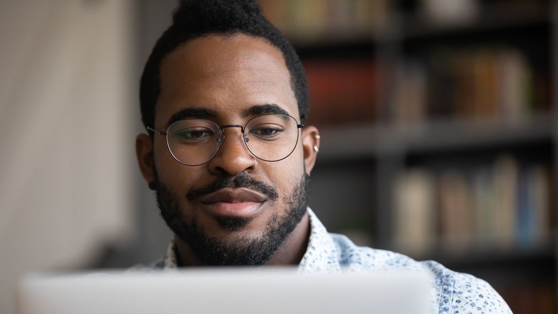 Man reading Northwestern Mutual Market Commentary