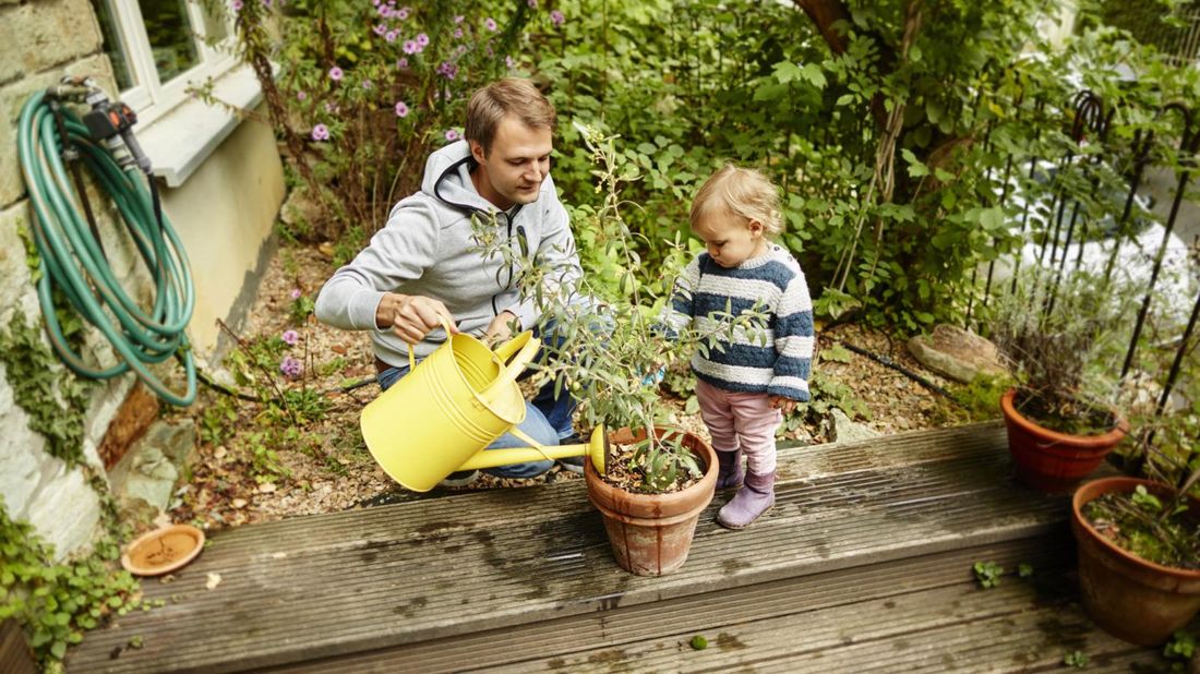 October-2021-Buy-skip-father-daughter-watering-plant