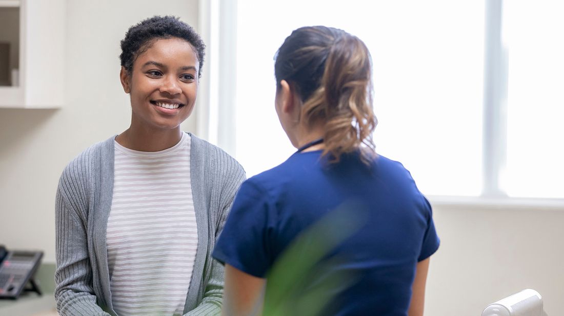 woman speaking with doctor