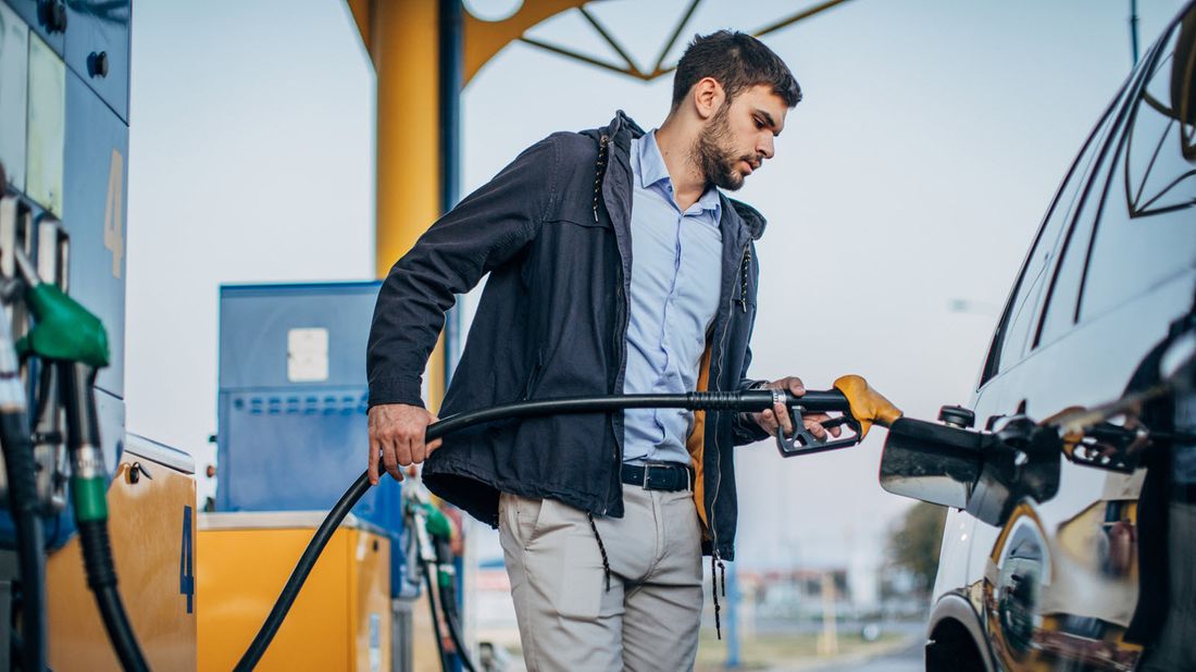 Man filling his gas tank at a service station