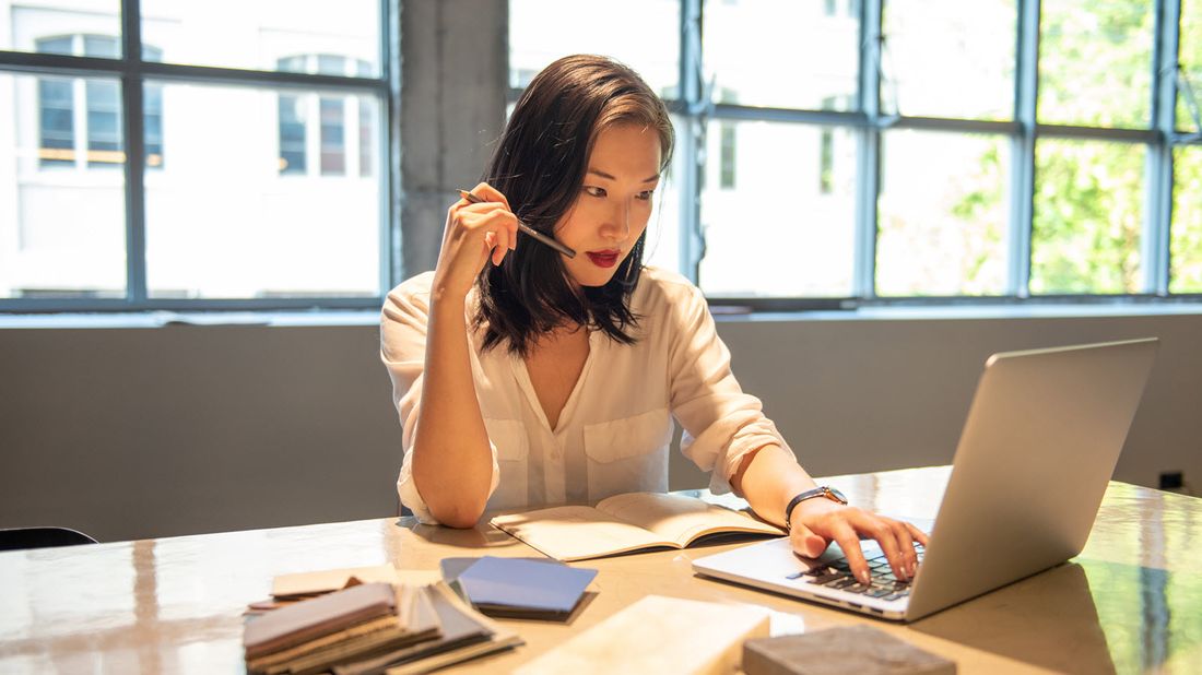 Woman reading Northwestern Mutual Market Commentary