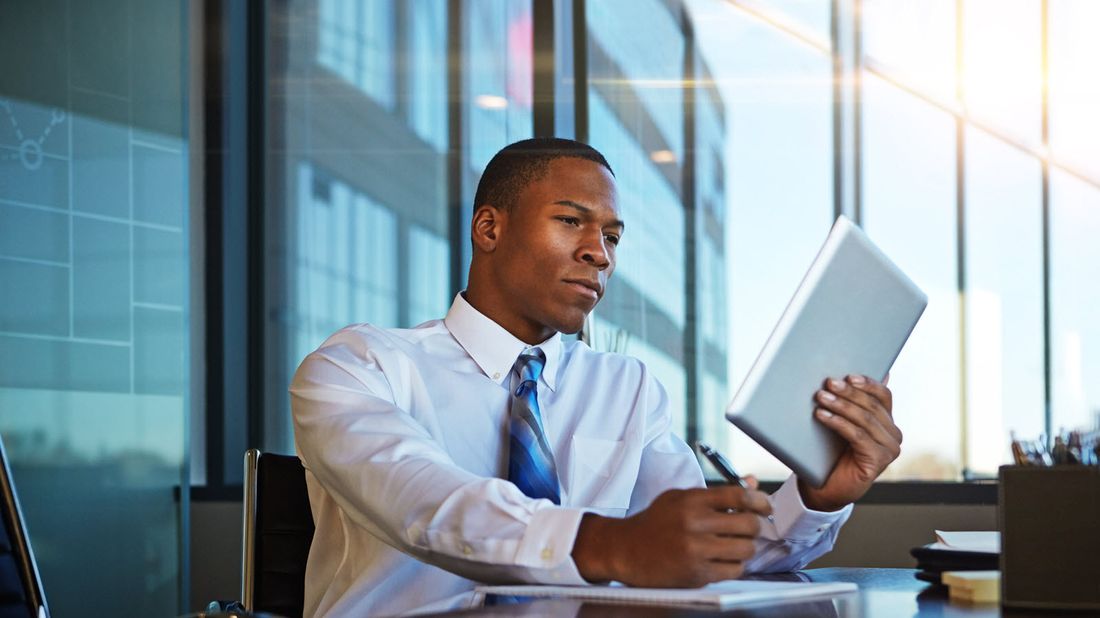 Man reading Northwestern Mutual Market Commentary