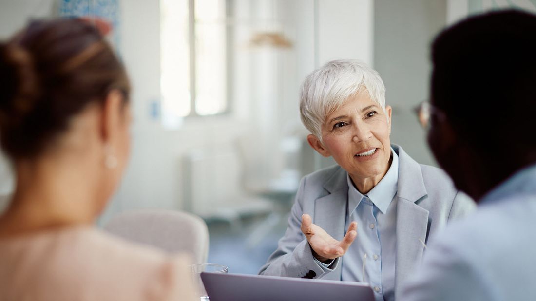 Couple discussing target-date funds with their financial advisor