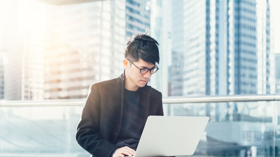 Man reading Northwestern Mutual market commentary 