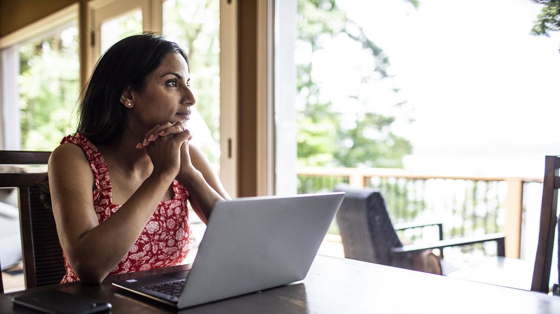 Woman reading Northwestern Mutual Market Commentary