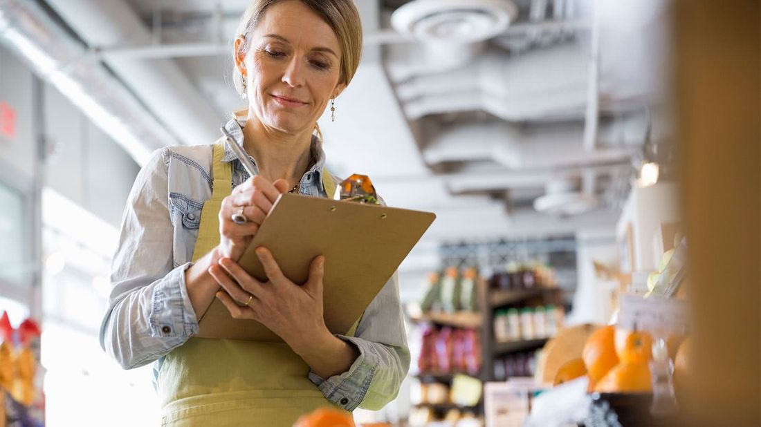 Woman looking for benefit options for business owners while working