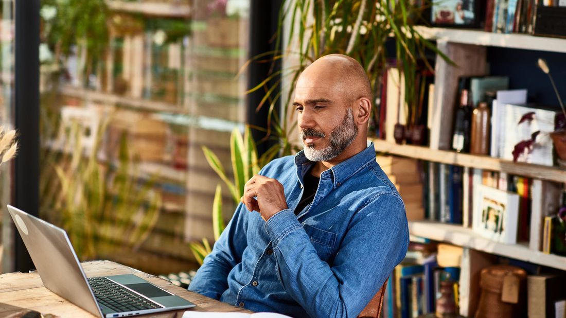 Man reading Northwestern Mutual Market Commentary