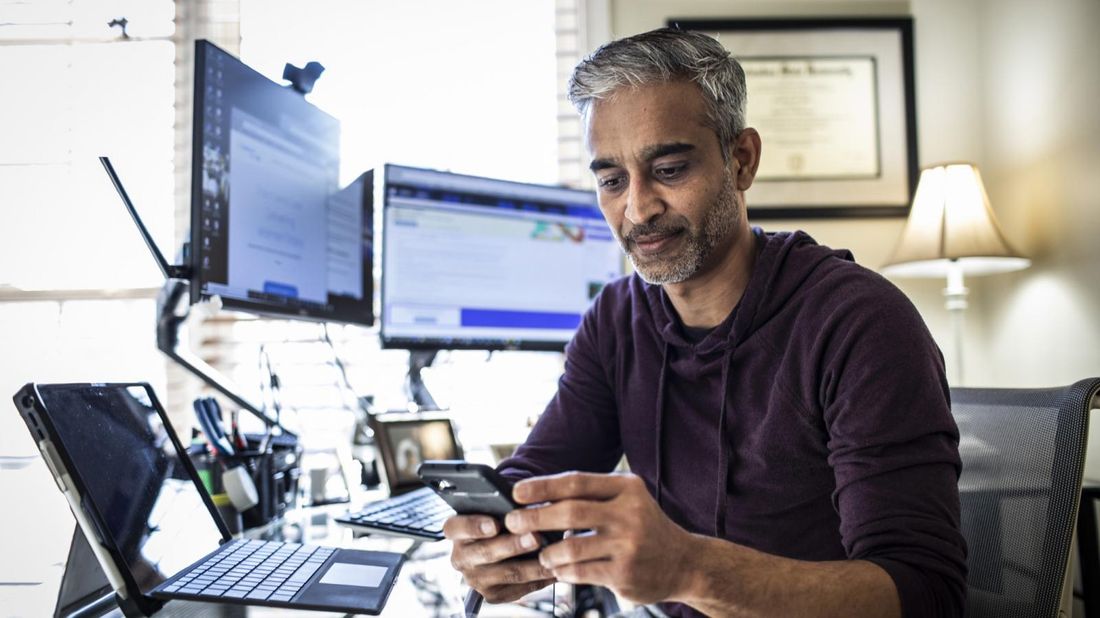 Man at work thinking about supplemental life insurance