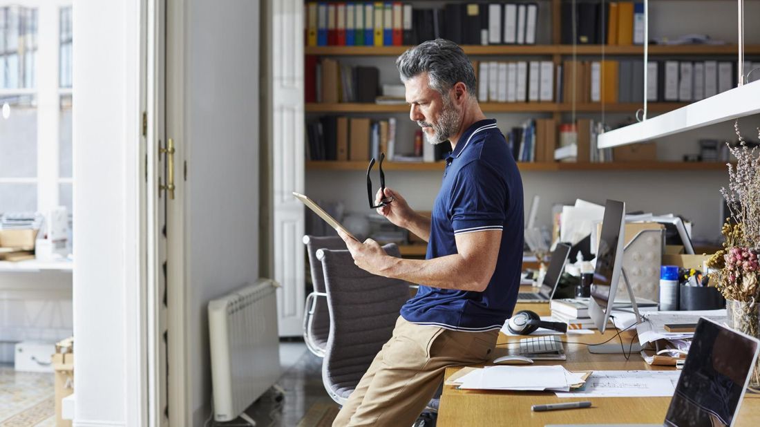 man on tablet looking for life insurance without a medical exam