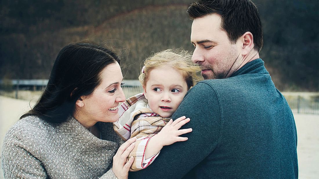 Family outside after talking money with a financial advisor