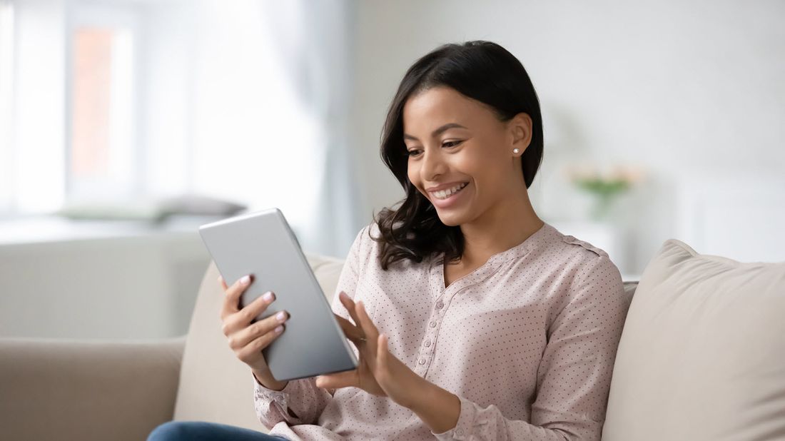 Woman reading Northwestern Mutual Market Commentary 