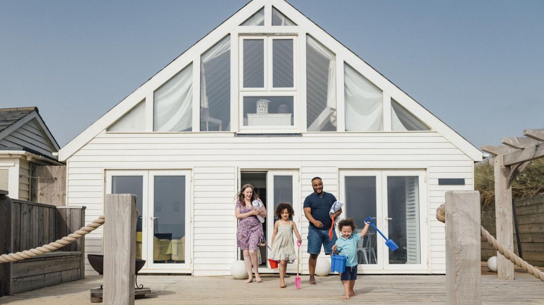 family coming out of beach investment property