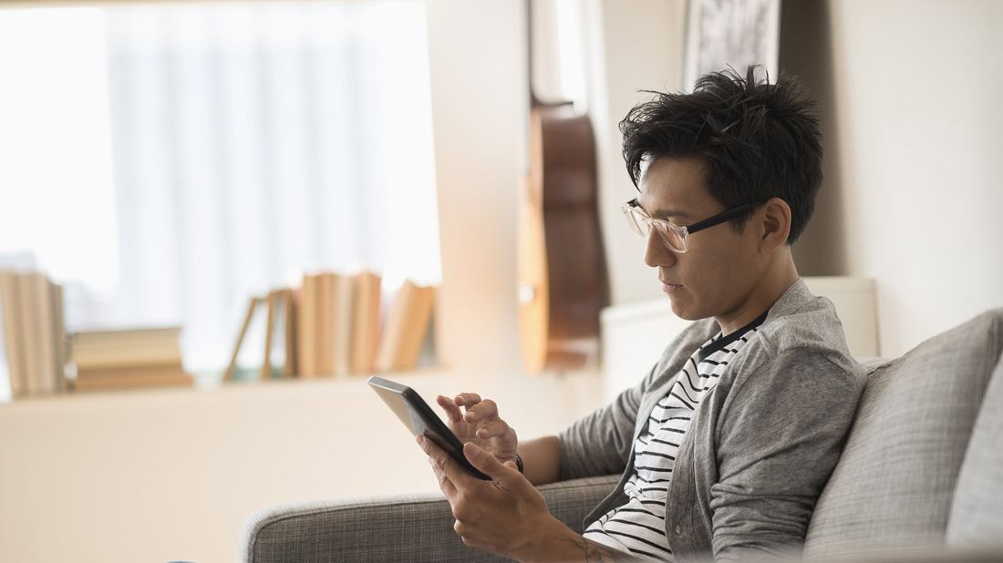 Man reading Northwestern Mutual Market Commentary